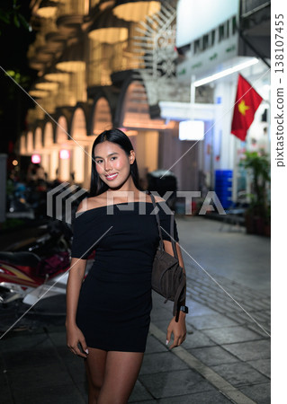 Thai Woman on Hanoi Street with Vietnam Flag Thai Woman on Hanoi Street with Vietnam Flag 138107455