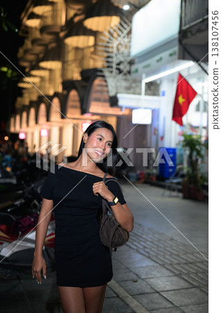 Thai Woman on Hanoi Street with Vietnam Flag Thai Woman on Hanoi Street with Vietnam Flag 138107456