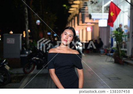Thai Woman on Hanoi Street with Vietnam Flag Thai Woman on Hanoi Street with Vietnam Flag 138107458