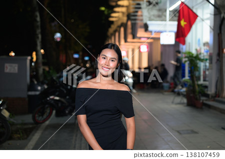 Thai Woman on Hanoi Street with Vietnam Flag Thai Woman on Hanoi Street with Vietnam Flag 138107459