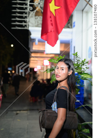Thai Woman on Hanoi Street with Vietnam Flag Thai Woman on Hanoi Street with Vietnam Flag 138107460