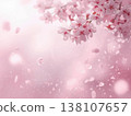 A soft spring background with cherry blossom petals fluttering in the wind. 138107657