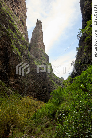 Dramatic Volcanic Canyon with Towering Rock Spire Dramatic Volcanic Canyon with Towering Rock Spire 138108833