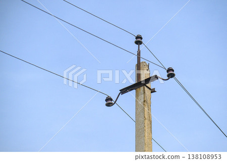 Utility pole with wires under blue sky Utility pole with wires under blue sky 138108953