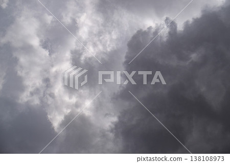 Dramatic storm clouds fill sky, creating intense atmosphere Dramatic storm clouds fill sky, creating intense atmosphere 138108973