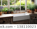 Rustic kitchen sink with potted herbs and garden view 138110023
