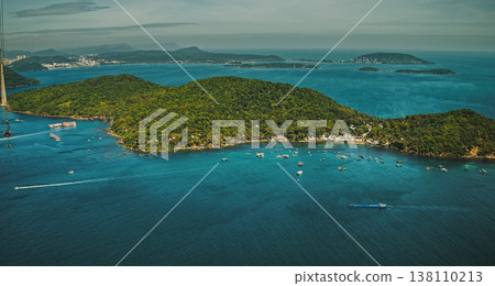 Aerial Panorama of Tropical Island Paradise with Anchored Boats and Lush Vegetation Aerial Panorama of Tropical Island Paradise with Anchored Boats and Lush Vegetation 138110213