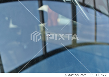 Windshield cracked by a flying stone Windshield cracked by a flying stone 138111477