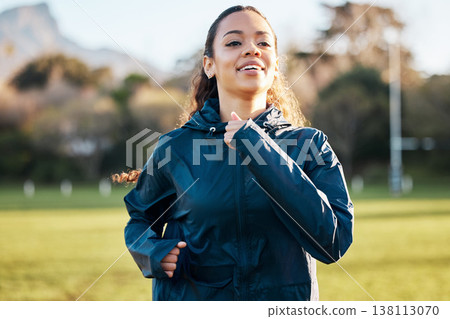 Fitness field, wellness and woman running for outdoor exercise, cardio workout or training for marathon race. Sports warm up, nature sunshine and morning runner doing athlete challenge on grass pitch 138113070