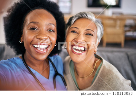 Selfie, face and assisted living caregiver with an old woman in the living room of a home together. Portrait, smile or support with a happy nurse or medical volunteer and senior patient in a house Selfie, face and assisted living caregiver with an old woman in the living room of a home together. Portrait, smile or support with a happy nurse or medical volunteer and senior patient in a house 138113083