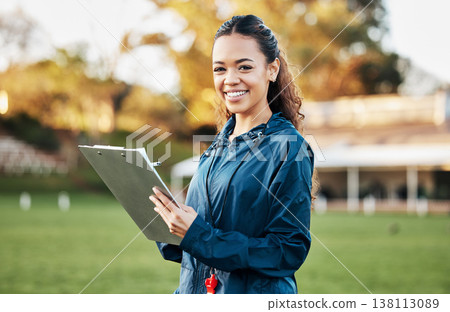 Coach, sports and portrait of woman with clipboard on field for training, planning and game strategy. Happy, writing and personal trainer outdoors for exercise, workout schedule and fitness routine Coach, sports and portrait of woman with clipboard on field for training, planning and game strategy. Happy, writing and personal trainer outdoors for exercise, workout schedule and fitness routine 138113089