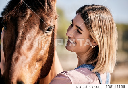 Face, smile for equestrian and a woman with her horse on a ranch for sports training, hobby or recreation. Fitness, stable and a happy young rider with her animal outdoor on a course for practice Face, smile for equestrian and a woman with her horse on a ranch for sports training, hobby or recreation. Fitness, stable and a happy young rider with her animal outdoor on a course for practice 138113166