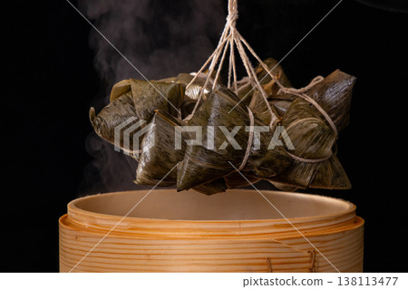 Steaming hot traditional handmade meat dumplings just out of the steamer 138113477