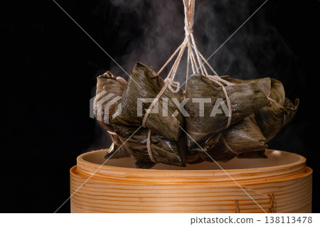 Steaming hot traditional handmade meat dumplings just out of the steamer 138113478