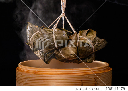 Steaming hot traditional handmade meat dumplings just out of the steamer Steaming hot traditional handmade meat dumplings just out of the steamer 138113479