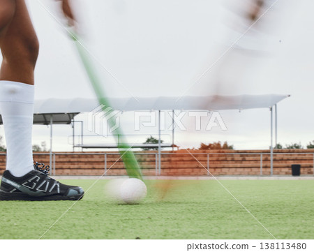 Person, legs and hockey stick on field, ball with speed or motion for sports goal, training or professional game. Action, feet and turf with performance for outdoor competition, fitness and exercise Person, legs and hockey stick on field, ball with speed or motion for sports goal, training or professional game. Action, feet and turf with performance for outdoor competition, fitness and exercise 138113480