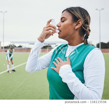 Asma, hockey woman and medical tool for breathing and healthcare outdoor on sport field. Female student, fitness and exercise in a game with training and workout with breathe for wellness and stress 138113536