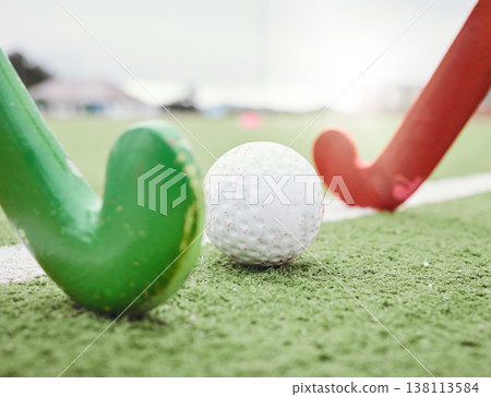 Hockey, game and stick with ball on green, field or pitch with sports equipment in competition, match ground or floor. Artificial grass, turf or training with gear in sport, tournament or stadium Hockey, game and stick with ball on green, field or pitch with sports equipment in competition, match ground or floor. Artificial grass, turf or training with gear in sport, tournament or stadium 138113584