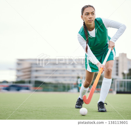 Field, hockey and woman running in game, tournament or competition with ball, stick and action on artificial grass. Sports, athlete and play in training, exercise or workout on green, pitch or ground 138113601