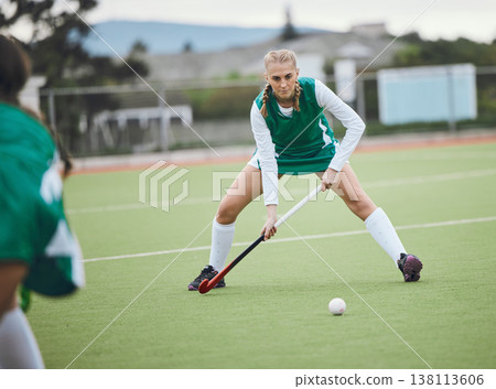 Field, hockey and woman in sports, game or action in competition with ball, stick and team on artificial grass. Sport, teamwork and women play in training, exercise or workout for goals in match 138113606