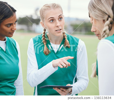 Leader, sports women or team planning tactics or strategy in a hockey training game, conversation or match. Tablet, talking or athletes in practice for fitness exercise together for teamwork in group Leader, sports women or team planning tactics or strategy in a hockey training game, conversation or match. Tablet, talking or athletes in practice for fitness exercise together for teamwork in group 138113634