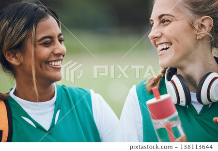 Laughing, team sports or women in conversation on turf or court for break after fitness training or exercise. Smile, happy friends or funny female hockey players speaking or talking to relax together 138113644