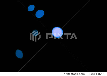 Bokeh, neon blue particles on black background and dots with pattern, texture and mockup with cosmic aesthetic. Night lighting, sparkle lights and glow on dark wallpaper with space, shine and flare. Bokeh, neon blue particles on black background and dots with pattern, texture and mockup with cosmic aesthetic. Night lighting, sparkle lights and glow on dark wallpaper with space, shine and flare. 138113648