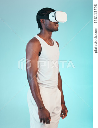Virtual reality, experience digital world and black man with future technology and holographic on blue background. UX, 3D and high tech with VR goggles, metaverse and scifi in studio with cyber space Virtual reality, experience digital world and black man with future technology and holographic on blue background. UX, 3D and high tech with VR goggles, metaverse and scifi in studio with cyber space 138113798