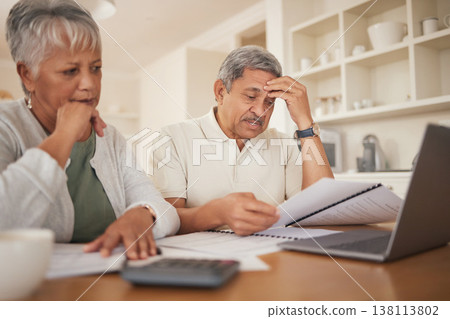 Debt, stress and senior couple with financial, bills and budget at computer with paperwork. Anxiety, banking problem and savings planning for pension and retirement in a home with web tax notes 138113802