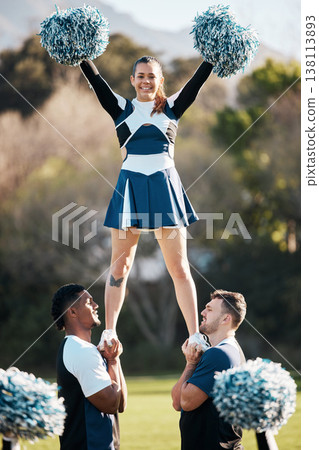 Cheerleader, sports and men balance woman on field for performance, dance and game motivation. Teamwork, dancer and people in costume cheer for support in match, competition and event outdoors 138113893