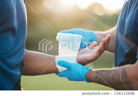 Sports, injury and man with bandage on wrist for accident, emergency and first aid for muscle sprain. Fitness, healthcare and medic with athlete with arm pain from exercise, workout and training 138113896