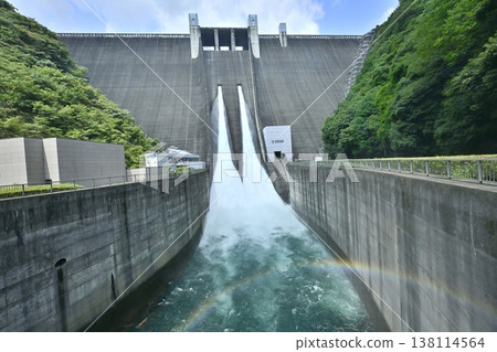 A rainbow over the spray and tourist-oriented water release at Miyagase Dam. A rainbow over the spray and tourist-oriented water release at Miyagase Dam. 138114564