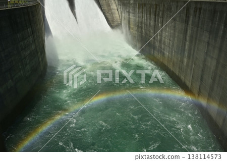 A rainbow over the spray and tourist-oriented water release at Miyagase Dam. 138114573