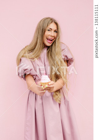 Happy Woman Holding Cupcake With Candle Happy Woman Holding Cupcake With Candle 138115111