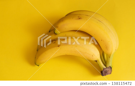 Bananas on a yellow background Bananas on a yellow background 138115472