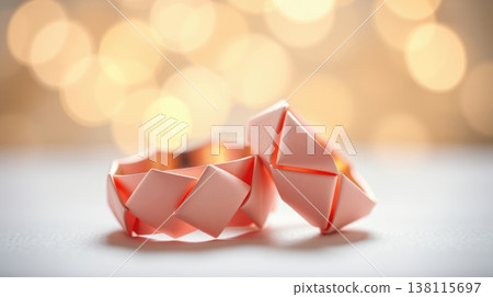 Paired rings captured in soft pastel glow. Refined and serene product shot. Paired rings captured in soft pastel glow. Refined and serene product shot. 138115697