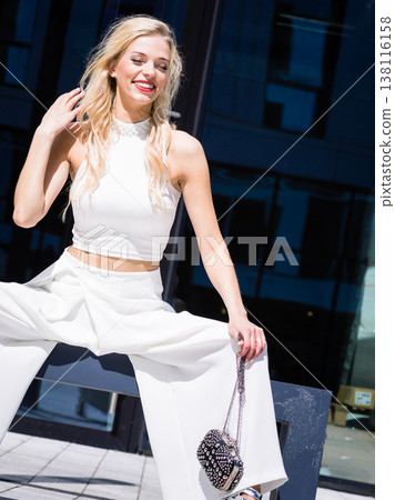 Woman wearing crop top and culottes Woman wearing crop top and culottes 138116158