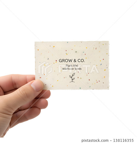 Hand holding a plantable business card embedded with wildflower seeds, representing sustainable marketing, eco-friendly branding, and green business Hand holding a plantable business card embedded with wildflower seeds, representing sustainable marketing, eco-friendly branding, and green business 138116355
