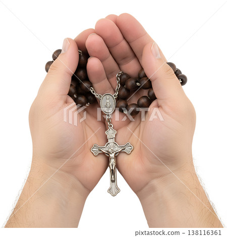 Hands gently holding a wooden rosary with a silver crucifix, symbolizing faith, prayer, spirituality, and religious devotion Hands gently holding a wooden rosary with a silver crucifix, symbolizing faith, prayer, spirituality, and religious devotion 138116361