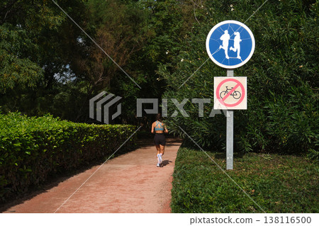 road signs bicycles prohibited and a treadmill in the park 138116500