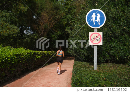 road signs bicycles prohibited and a treadmill in the park road signs bicycles prohibited and a treadmill in the park 138116502