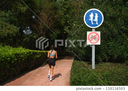 road signs bicycles prohibited and a treadmill in the park road signs bicycles prohibited and a treadmill in the park 138116503