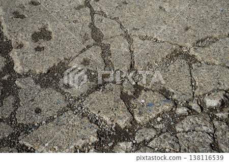 Cracked road surface 138116539