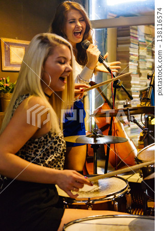 Woman singing, band playing instruments. Woman singing, band playing instruments. 138116574