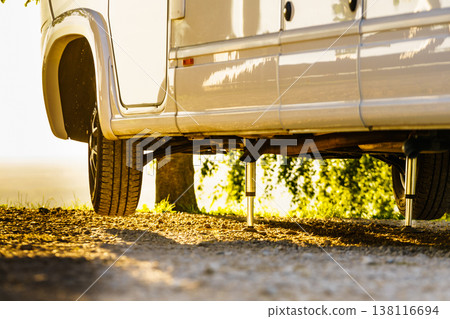 Camper with hydraulic leg in use. Rv levelling system Camper with hydraulic leg in use. Rv levelling system 138116694