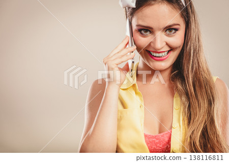 Retro pin up girl talking on mobile phone 138116811