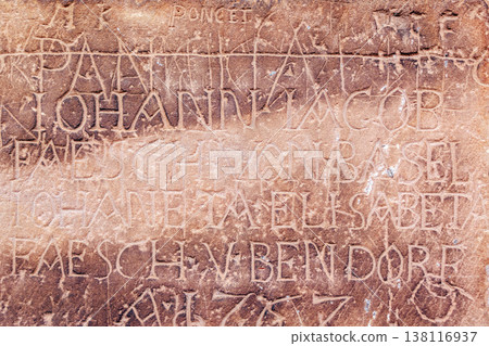 Historic engravings on stone wall of Strasbourg Cathedral, France 138116937