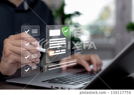 Person using laptop with virtual document checklist, compliance verification and digital approval interface Person using laptop with virtual document checklist, compliance verification and digital approval interface 138117758