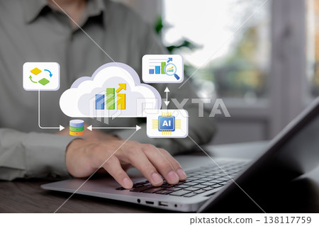 Person using laptop with virtual cloud analytics, AI data platform and business intelligence interface Person using laptop with virtual cloud analytics, AI data platform and business intelligence interface 138117759