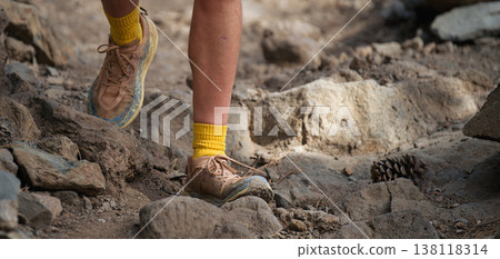 Walking or running exercise legs on rocky footpath in bright forest achievement fitness adventure and exercising in spring or summer nature motivation and inspirational activity 138118314